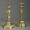 Pair of rococo brass candlesticks