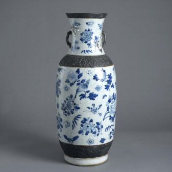 Tall blue and white glazed vase