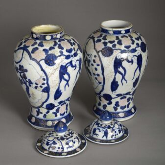 Pair of polychrome vases and covers