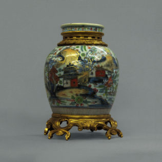 A Clobbered Chinese Porcelain Vase and Cover