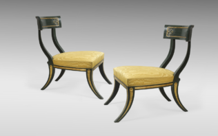 A pair of simple regency klismos chairs