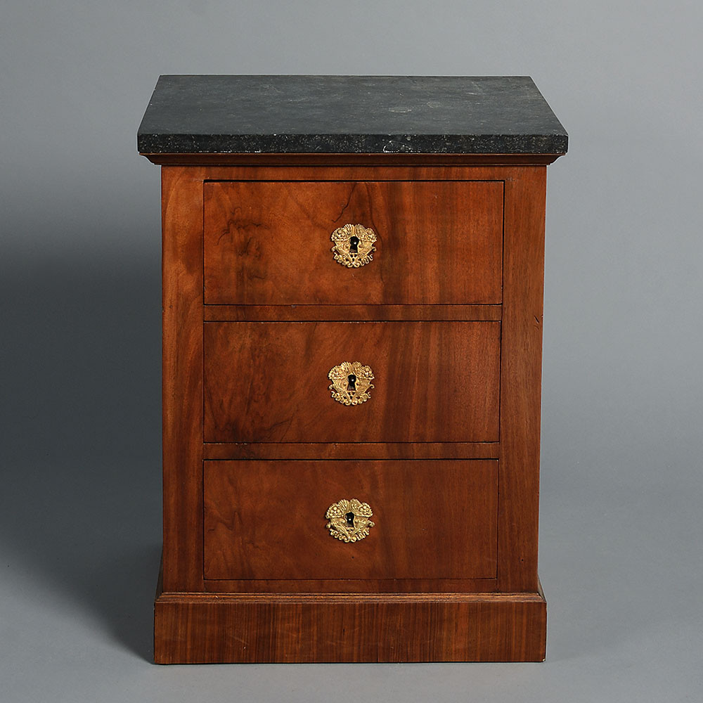 An early 19th century empire period bedside cabinet