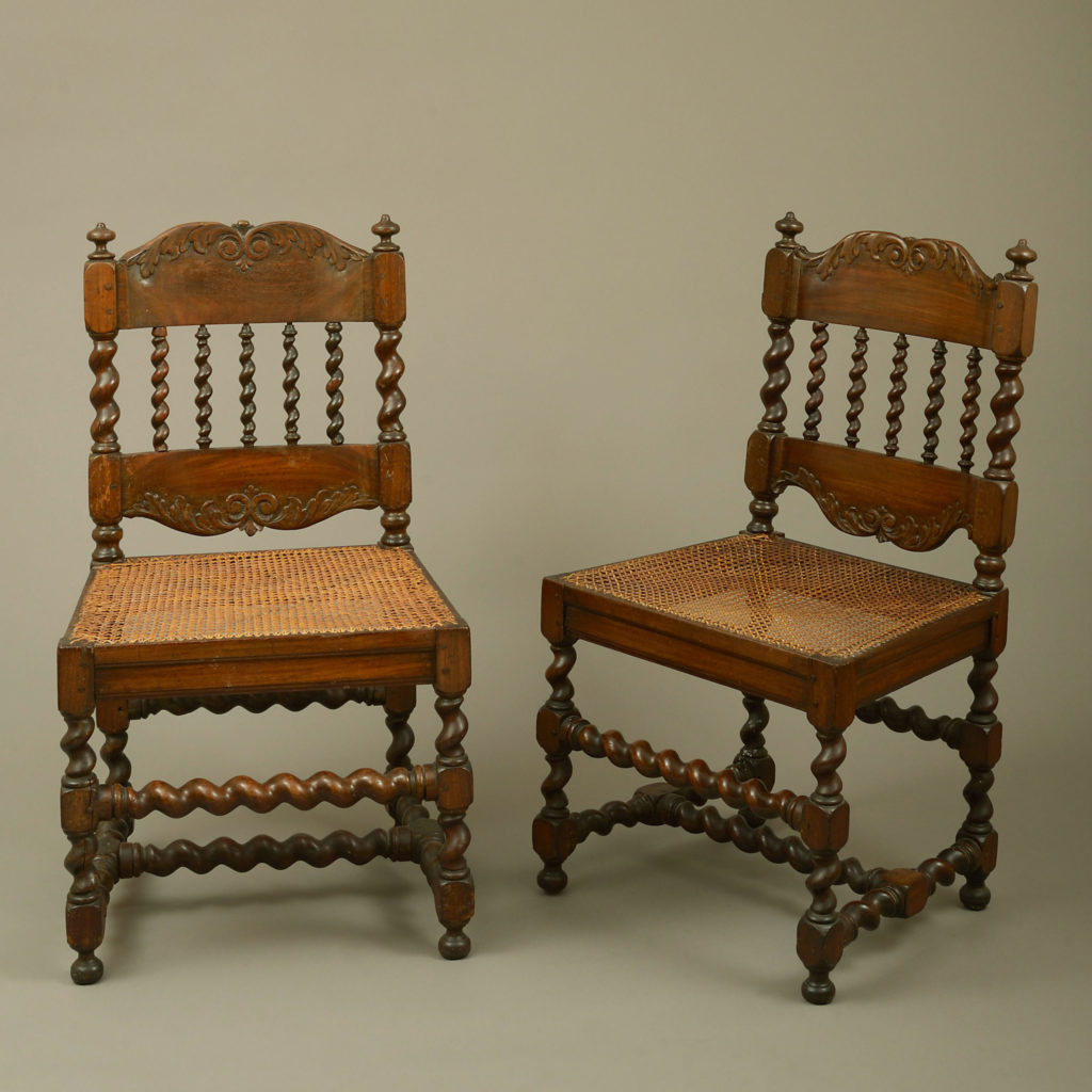 An early 18th century pair of cape dutch stinkwood chairs