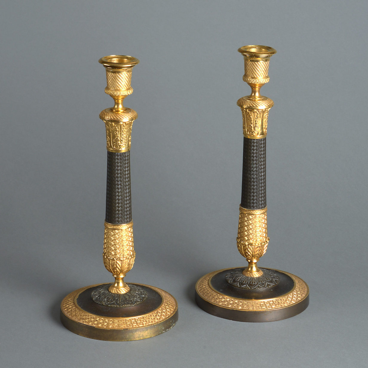 A pair of early 19th century charles x ormolu and bronze candelabra