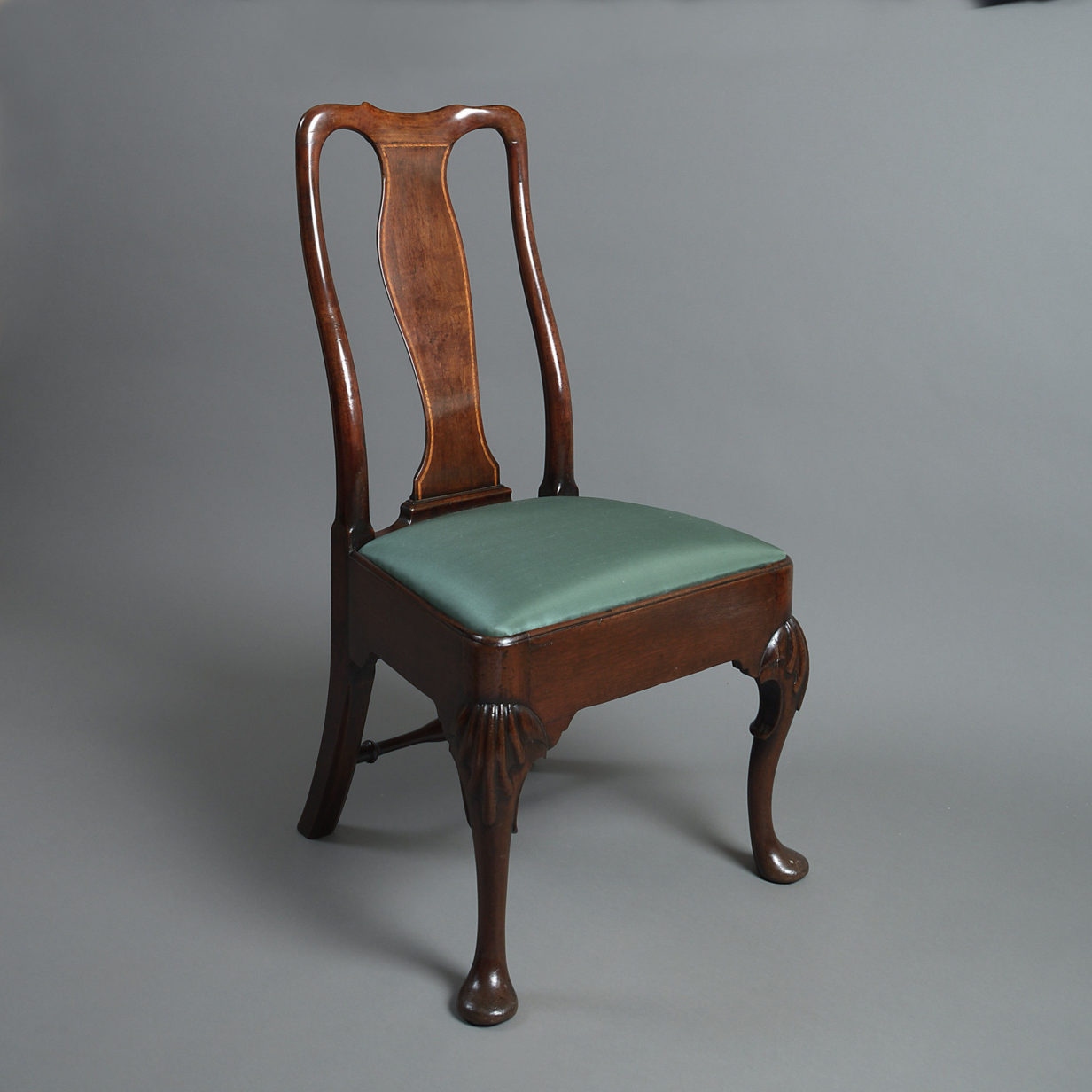 An 18th century set of four george ii period walnut side chairs