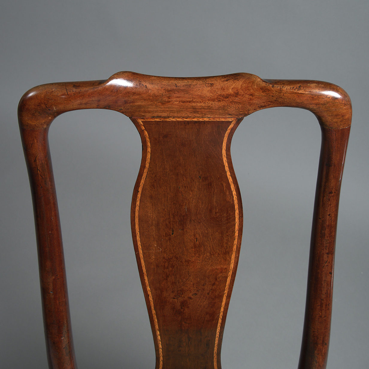 An 18th century set of four george ii period walnut side chairs