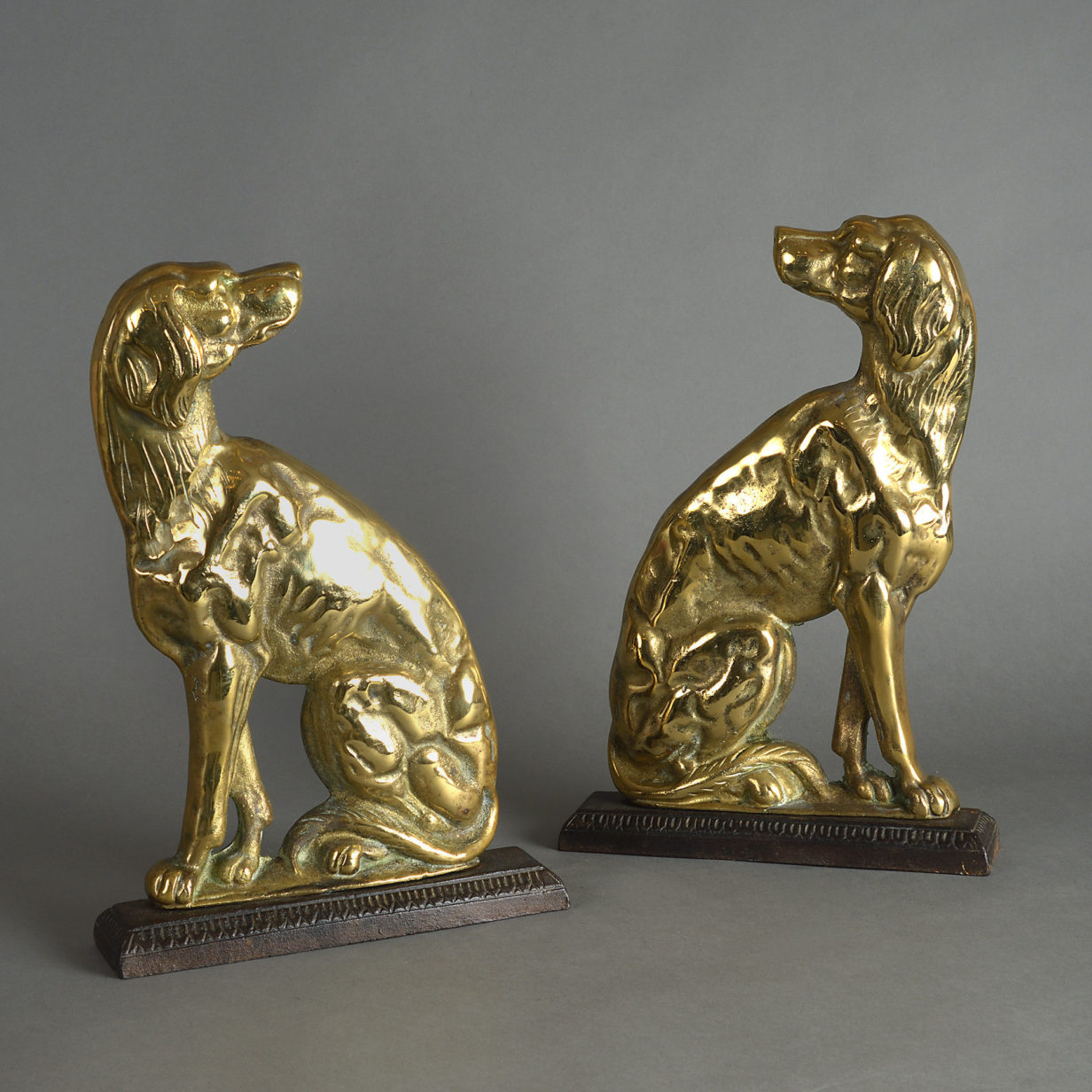 A pair of 19th century brass dog doorstops