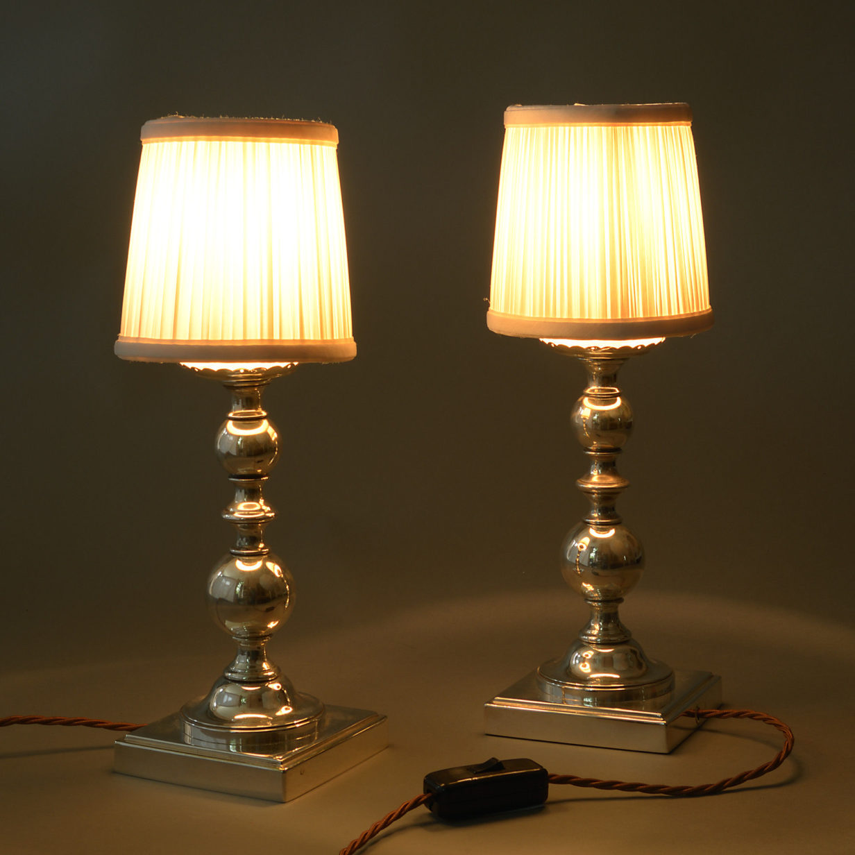 Early 20th century pair of silvered table lamps