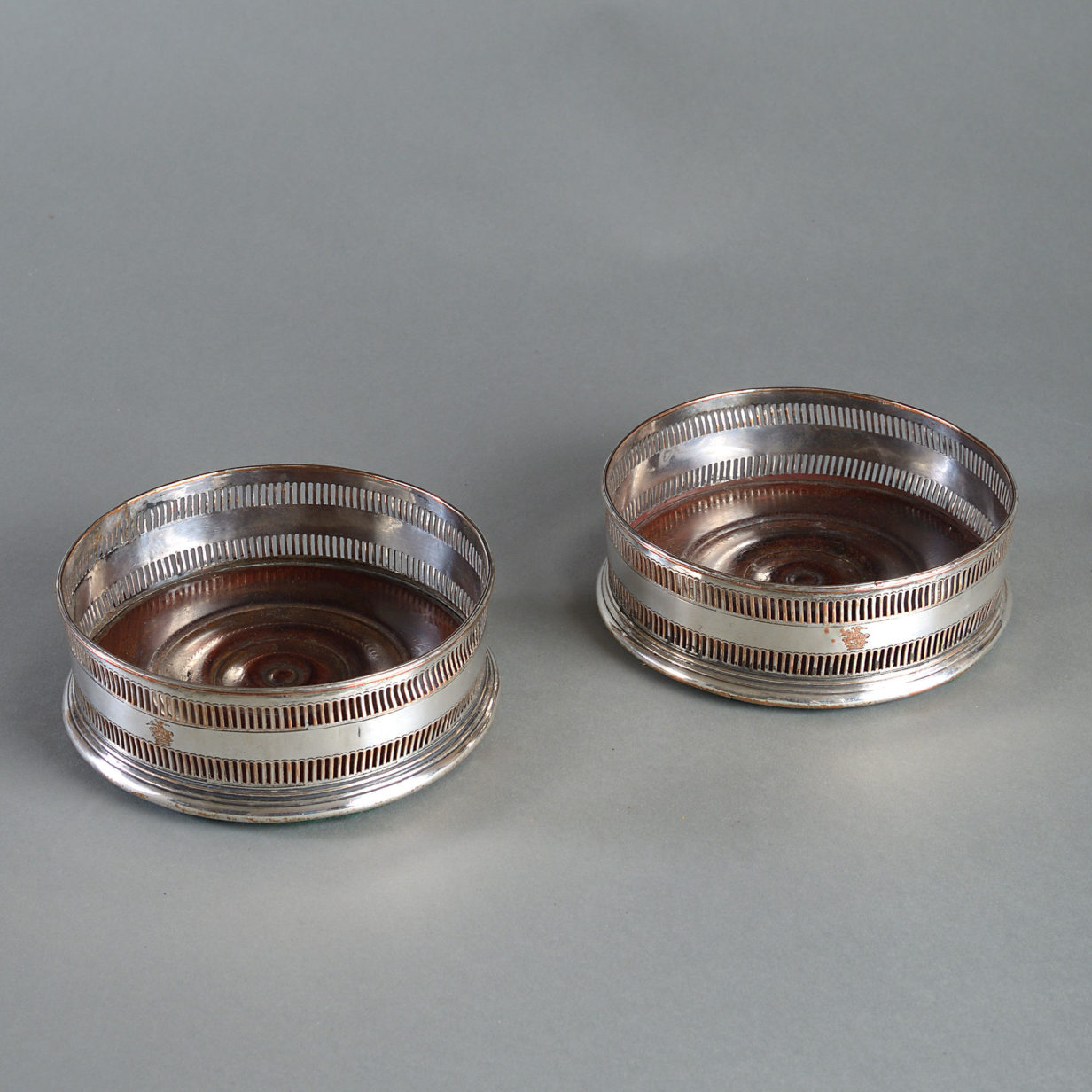 Early 19th century pair of sheffield plated wine coasters