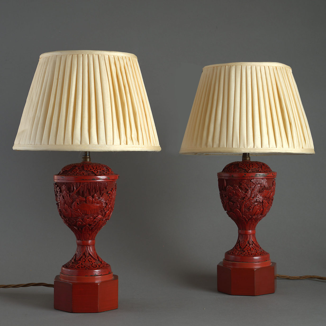 A pair of 19th century red cinnabar lacquer vase lamp bases