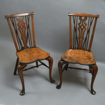 A pair of windsor hall chairs