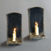 A pair of silvered wall lights