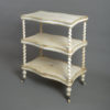 Mid-19th century white painted and gilded three tier etagere table