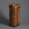 A late 19th century stitched leather army shell case possible umbrella or stick stand