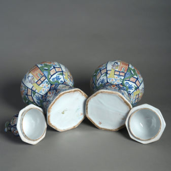 Early 20th century pair of delft vases & covers