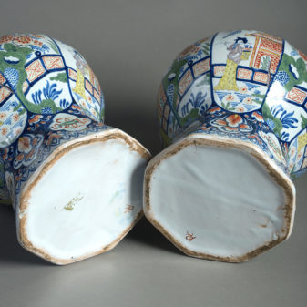 Early 20th century pair of delft vases & covers