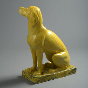 Lifesize bright yellow ceramic statue of a pointer dog