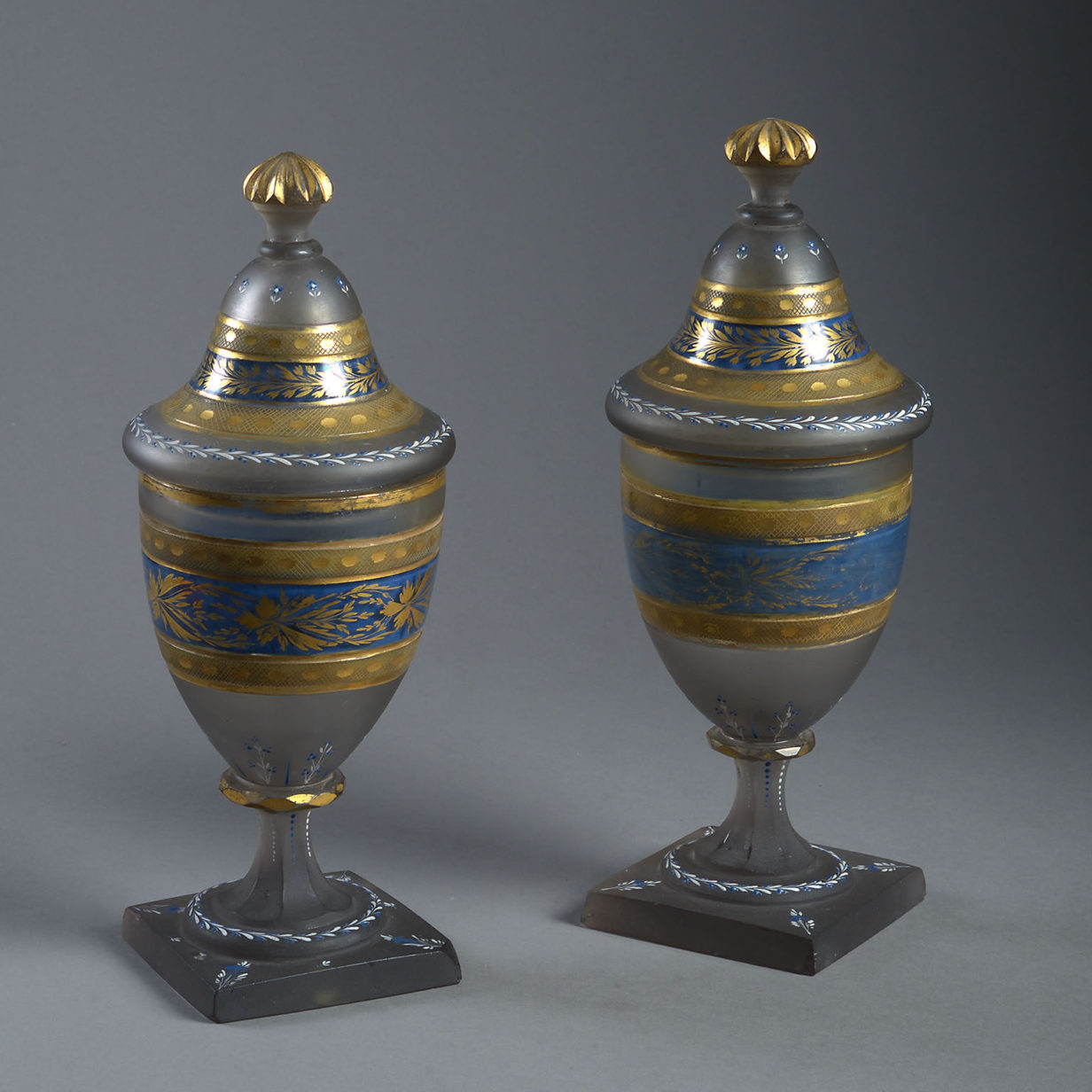Pair of early 19th century glass lidded vases