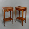 A pair of walnut bedside tables in the louis xv manner