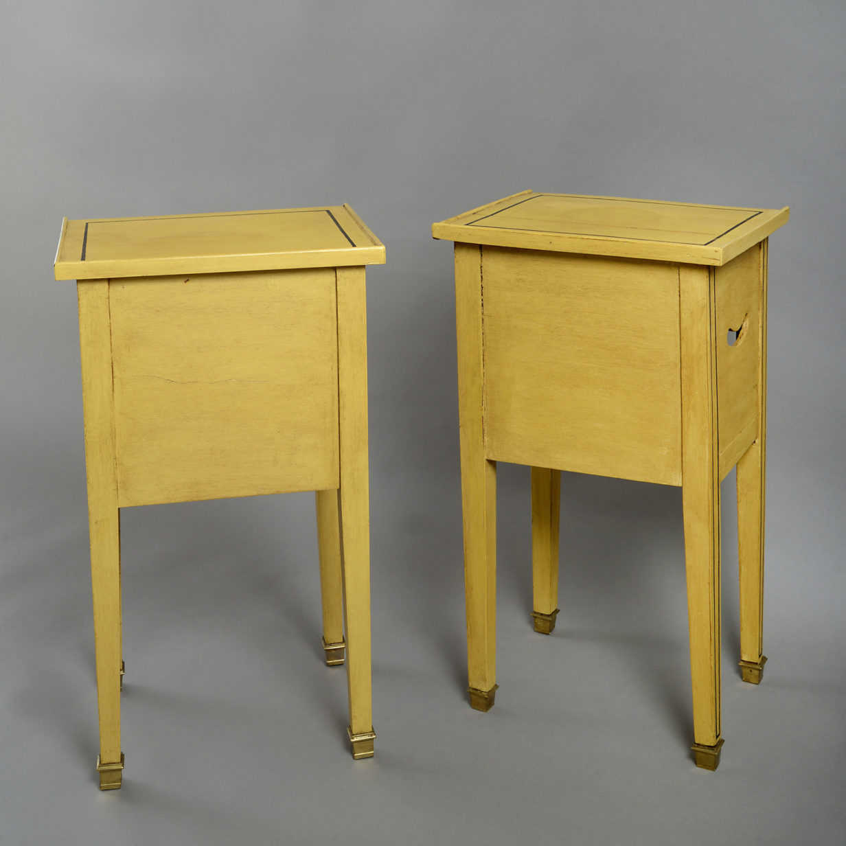 A pair of 19th century painted bedside tables