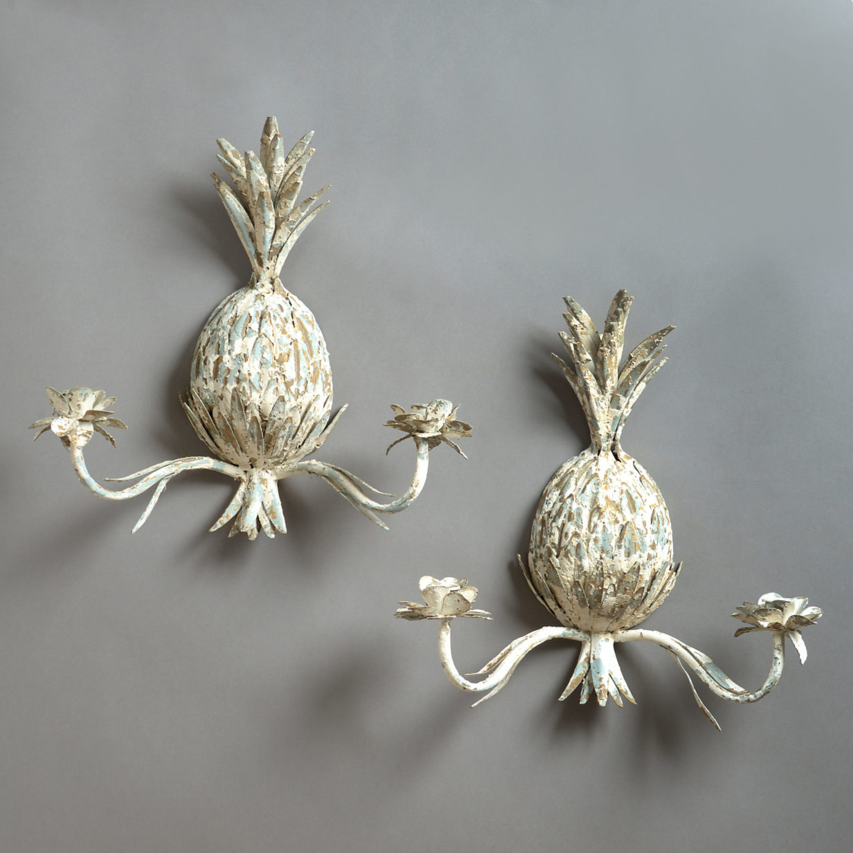 A pair of 20th century tole pineapple wall lights