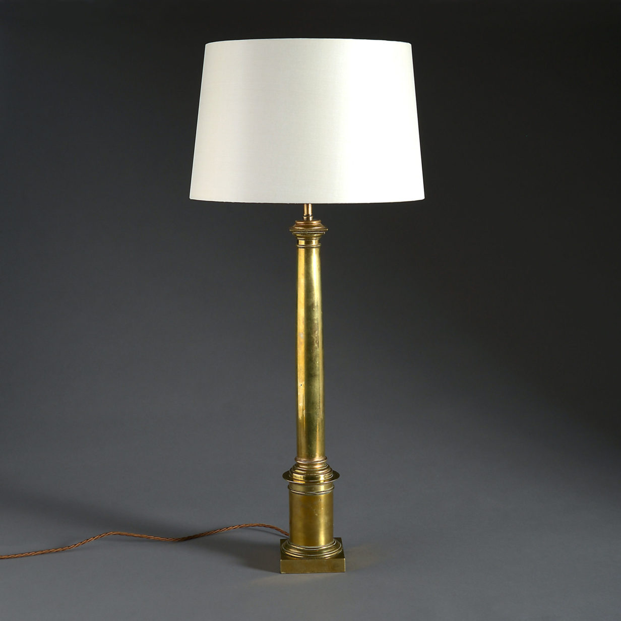 A 19th century brass column lamp