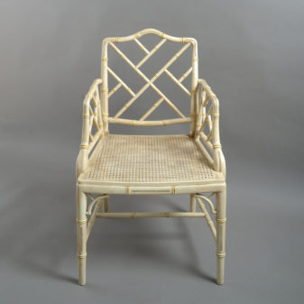 A mid-20th century pair of painted chinoiserie cockpen armchairs