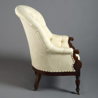 A 19th century deep buttoned bergère armchair