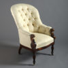 A 19th century deep buttoned bergère armchair