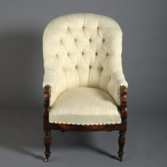 A 19th century deep buttoned bergère armchair