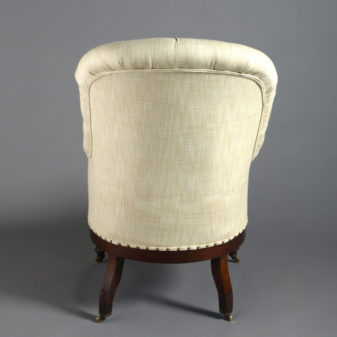 A 19th century deep buttoned bergère armchair