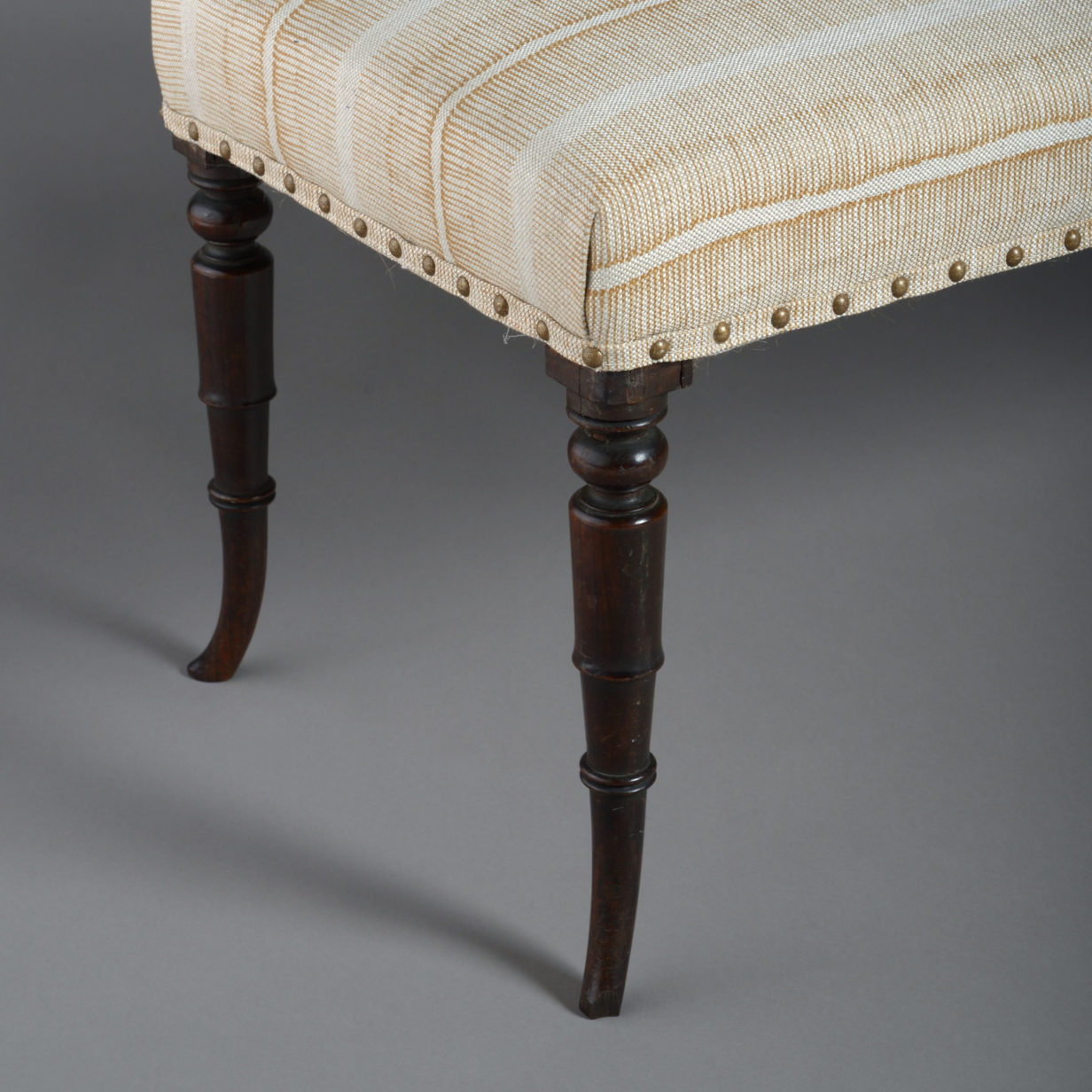 An early 19th century regency period long stool