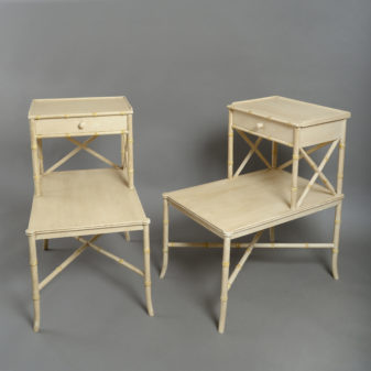 A pair of faux bamboo bedside tables