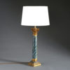 A faux marble & carved giltwood column lamp