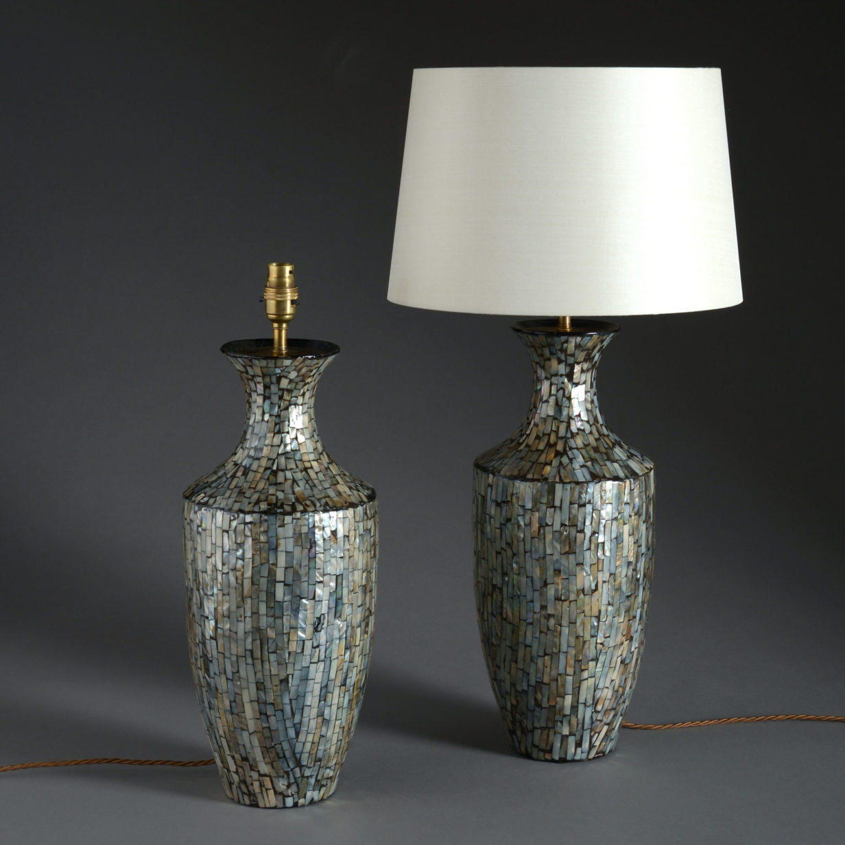 A pair of mid-century mother of pearl mosaic lamp bases
