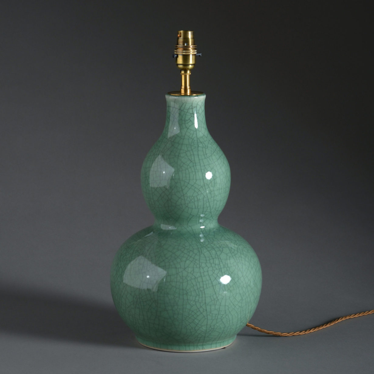 A pair of celadon porcelain gourd shaped vase lamps