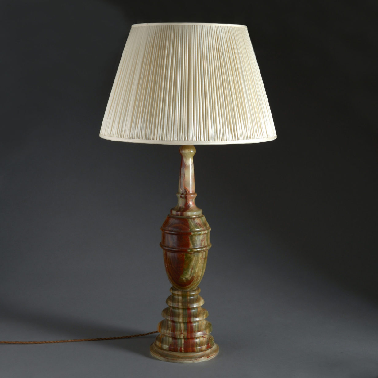 A tall art deco turned onyx table lamp