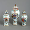 A garniture of three 19th century samson vases & covers