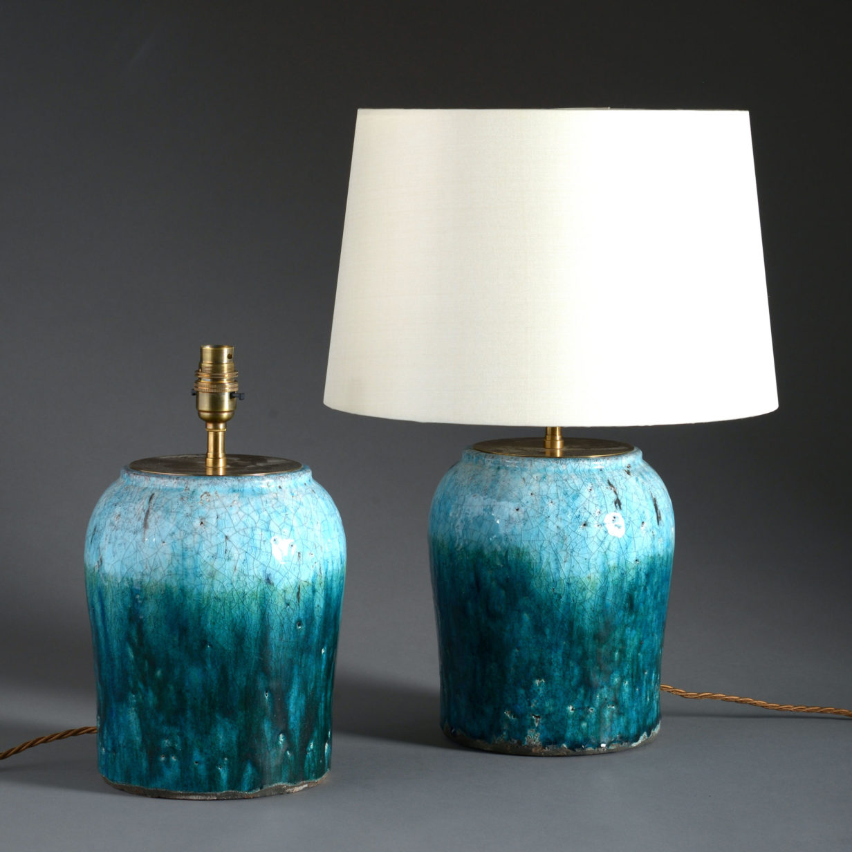 A pair of turquoise crackle glaze pottery vases as lamps