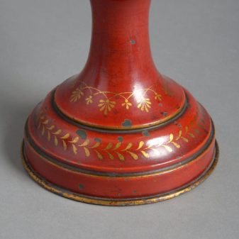 A pair of red toleware late 19th century covered urns