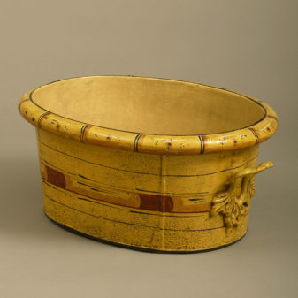 A 19th century tole planter with faux bamboo decoration