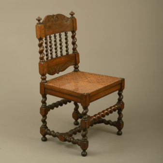 An early 18th century pair of cape dutch stinkwood chairs