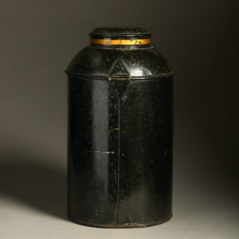 A 19th century black painted tole tea canister