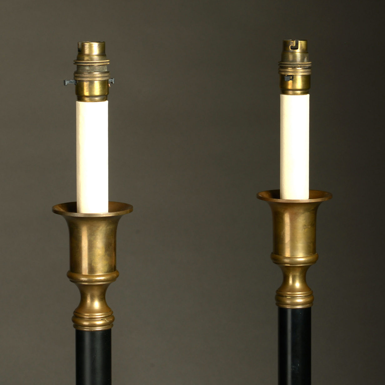 A pair of brass and cold painted steel column lamps