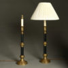 A pair of brass and cold painted steel column lamps