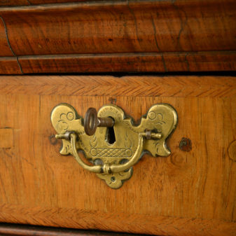 An early 18th century queen anne period walnut chest on stand