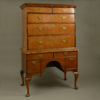 An early 18th century queen anne period walnut chest on stand