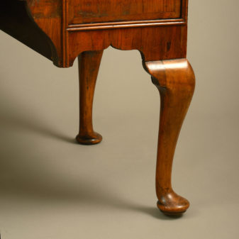 An early 18th century queen anne period walnut chest on stand