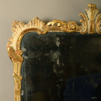 A mid-18th century irish george iii carved giltwood mirror