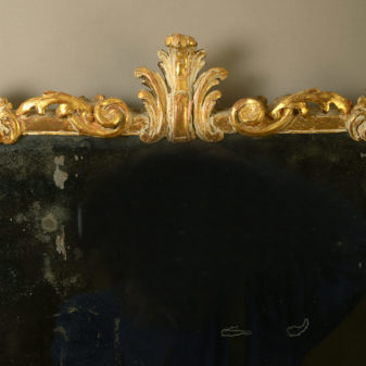 A mid-18th century irish george iii carved giltwood mirror
